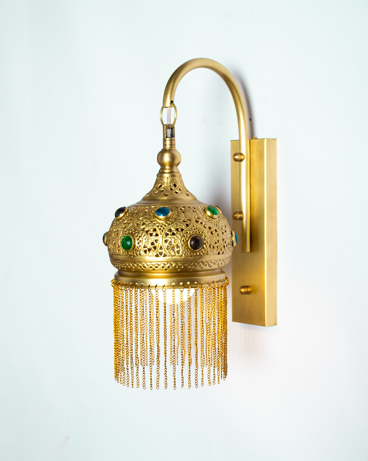 Repoussé glass inlay wall light